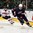 GRAND FORKS, NORTH DAKOTA - APRIL 19: USA's James Greenway #14 skates with the puck while Switzerland's Philipp Kurashev #23 chases him down during preliminary round action at the 2016 IIHF Ice Hockey U18 World Championship. (Photo by Minas Panagiotakis/HHOF-IIHF Images)

